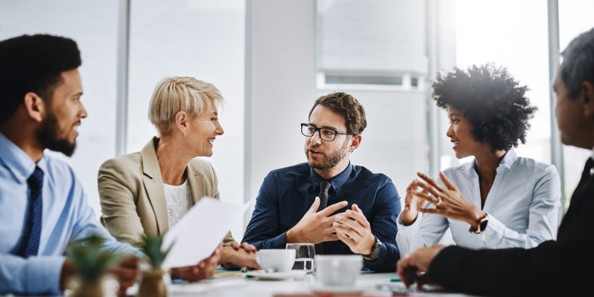 business people sitting at table